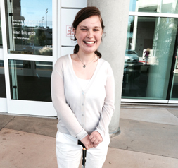 Taylor Carty smiling in front of medical building