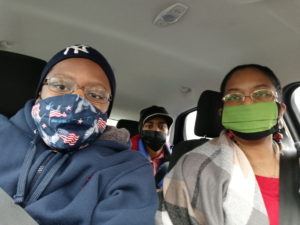 Cheryl and her family wearing face masks during the COVID-19 pandemic