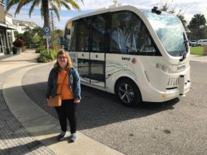 Jessica Sahlman standing in front of a bus