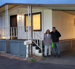 Hector Ramirez in front of new home