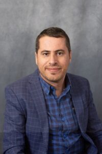 Headshot of Dr. Mustafa Rfat, a man with dark brown hair